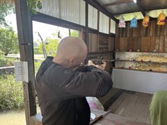 Dom shooting a pop gun.